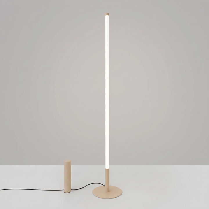 Lampadaire TRANG beige allumée, tube lumineux