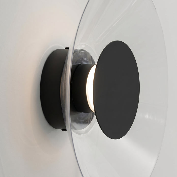 Applique murale ASTRO noir vue de profil, disque transparent