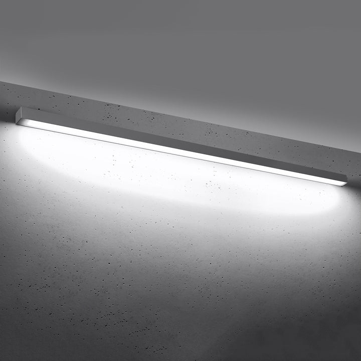 Applique murale linéaire PINNE gris allumée, lumière vers le bas