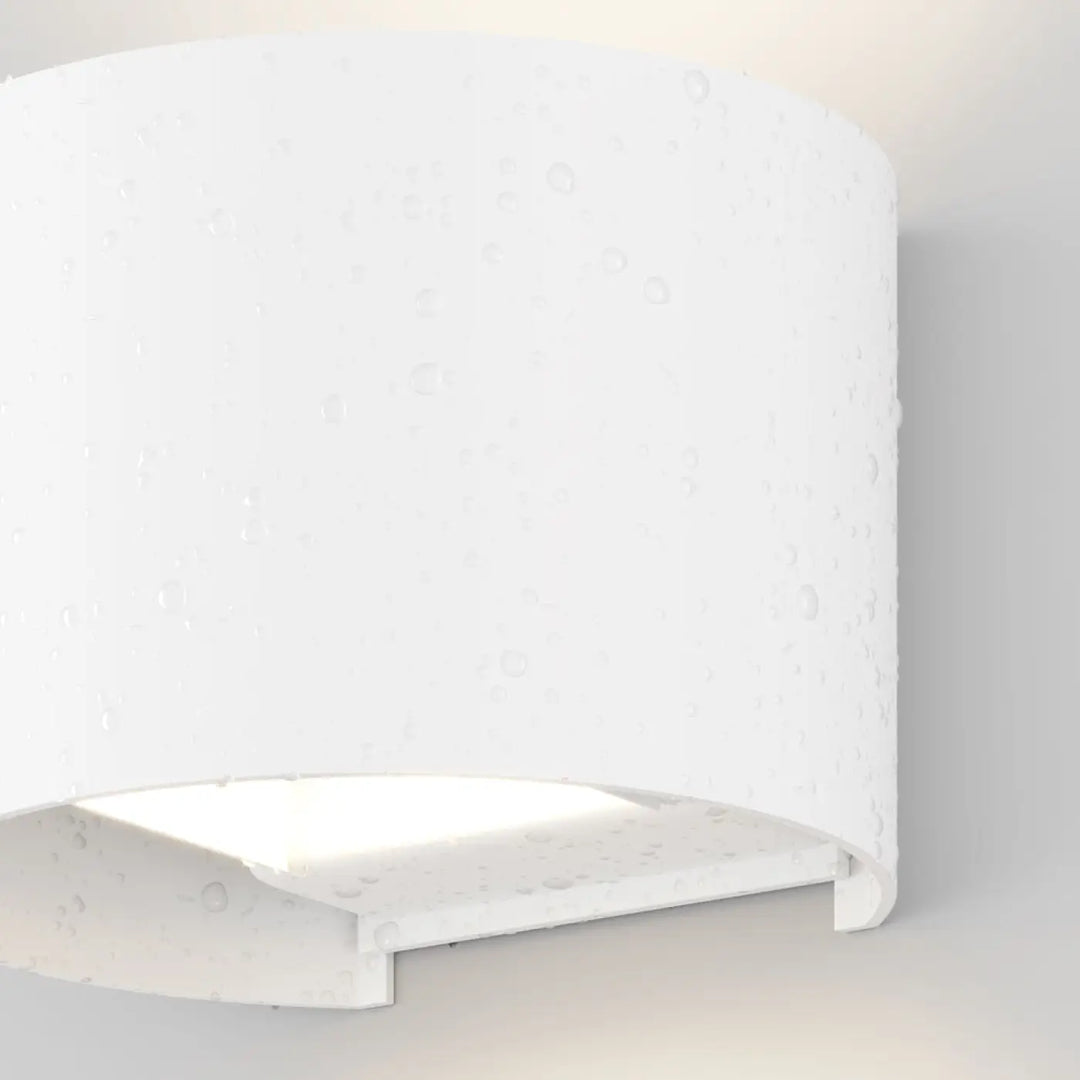 Applique extérieure fulton volume arrondi en céramique blanche texturée avec double faisceau lumineux élégant et moderne