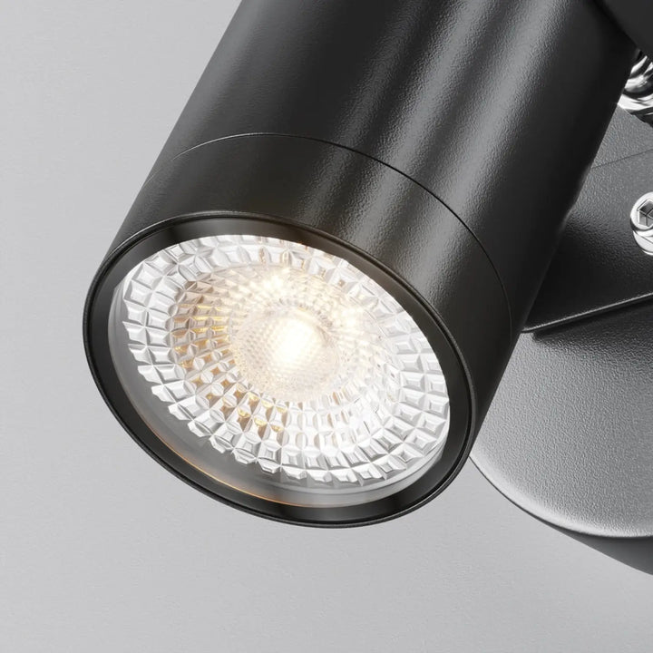 Applique extérieure scope projecteur orientable en acier noir avec finition texturée et lentille facettée claire