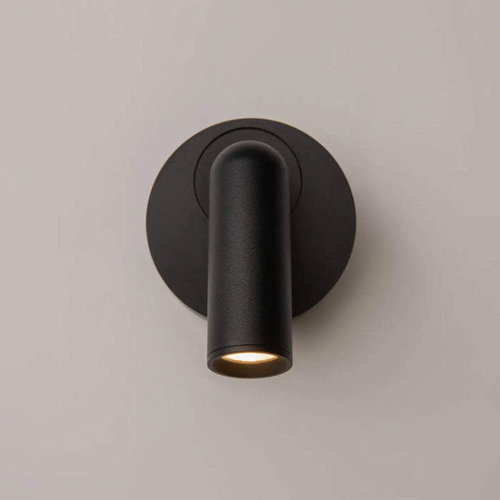 Applique murale noire cylindre en finition mate avec liseuse mirax led chaude module rond pour éclairage d ambiance