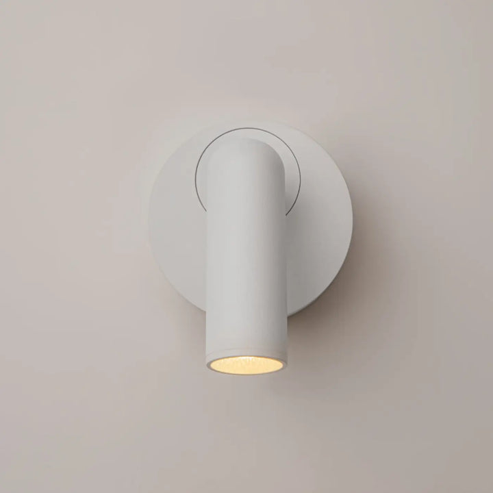 Applique liseuse mirax avec module rond en métal blanc et lumière cylindrique ajustable à illumination chaude