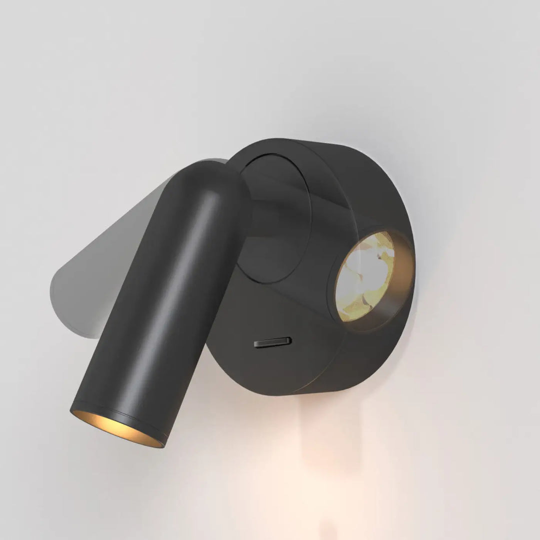 Applique liseuse mirax noire mate avec module rond ajustable en métal pour lecture murale élégante