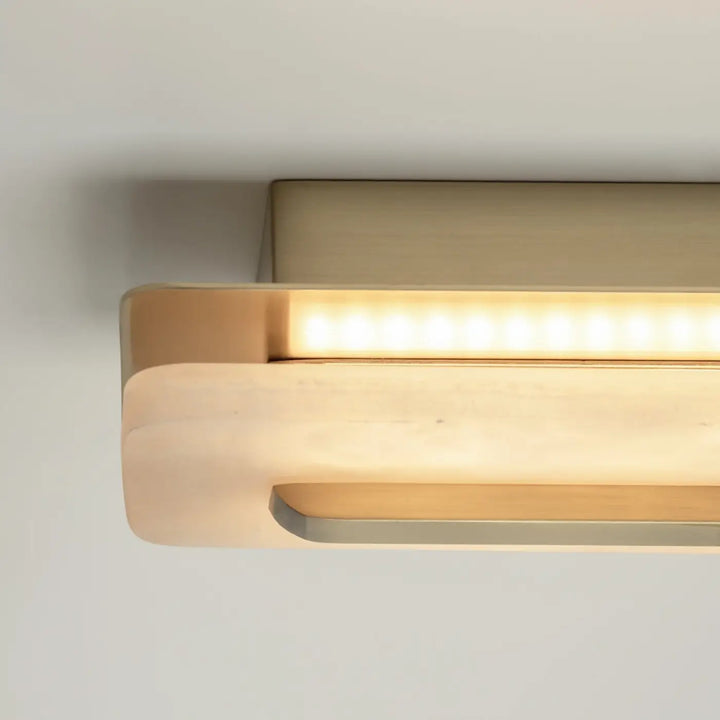 Applique murale albatre en led dorée moderne avec design minimaliste et trois longueurs pour éclairage d ambiance chaleureux