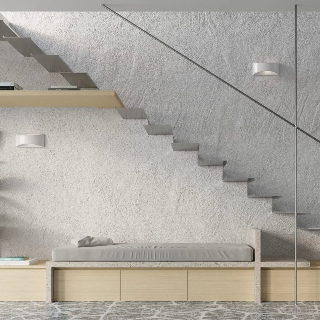 Minimalist gray upholstered bench with light wood frame and integrated storage drawers for céramique vixen display