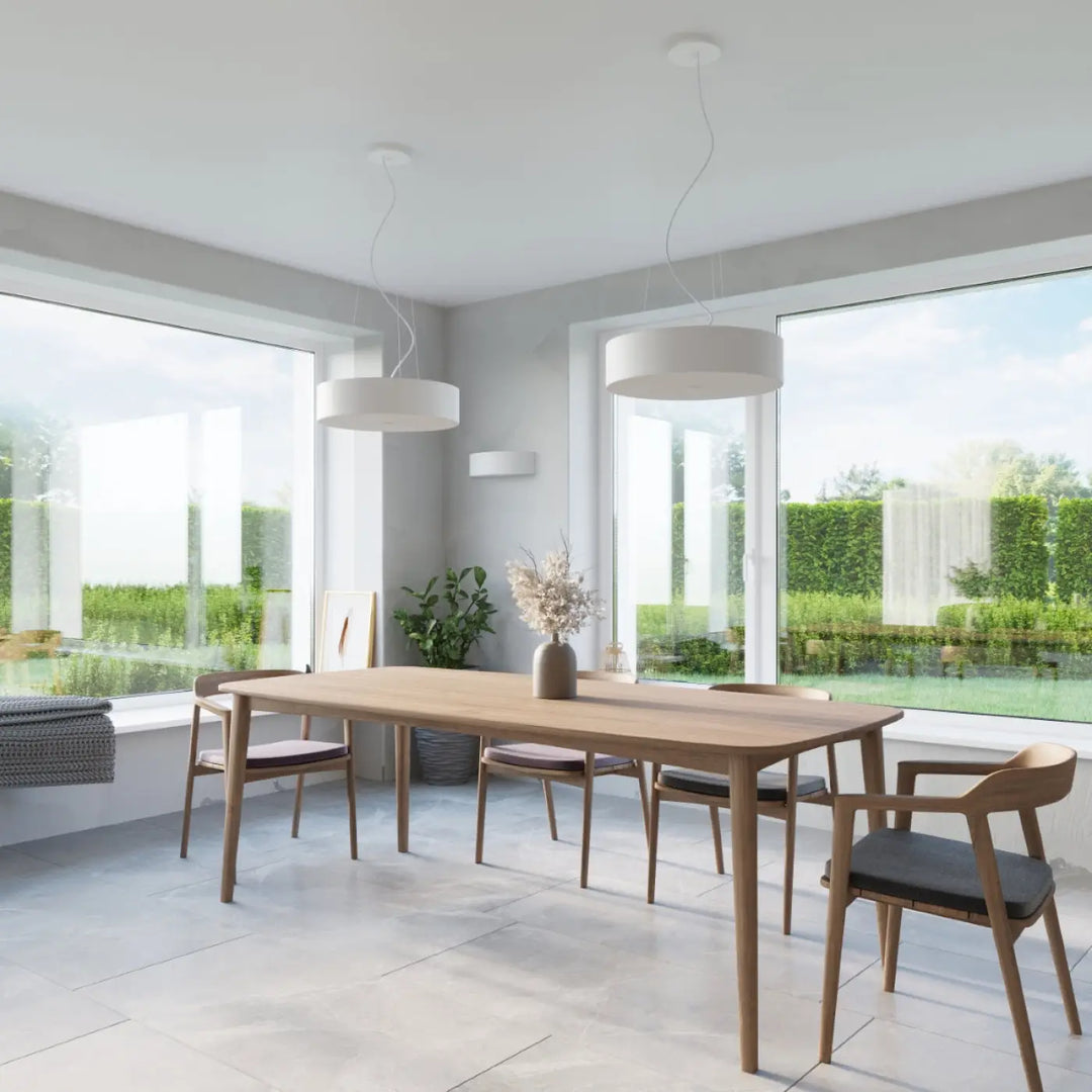 Light wood dining table with sleek minimalist design and rounded edges paired with l’applique murale skala blanc combiné l’acier industriel