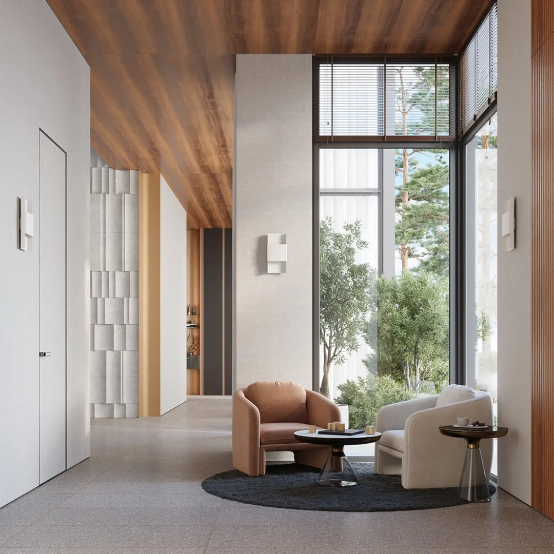 Tan leather armchair with rounded back beside a white armchair illustrating l’applique murale durlin dans un minimalisme rencontre