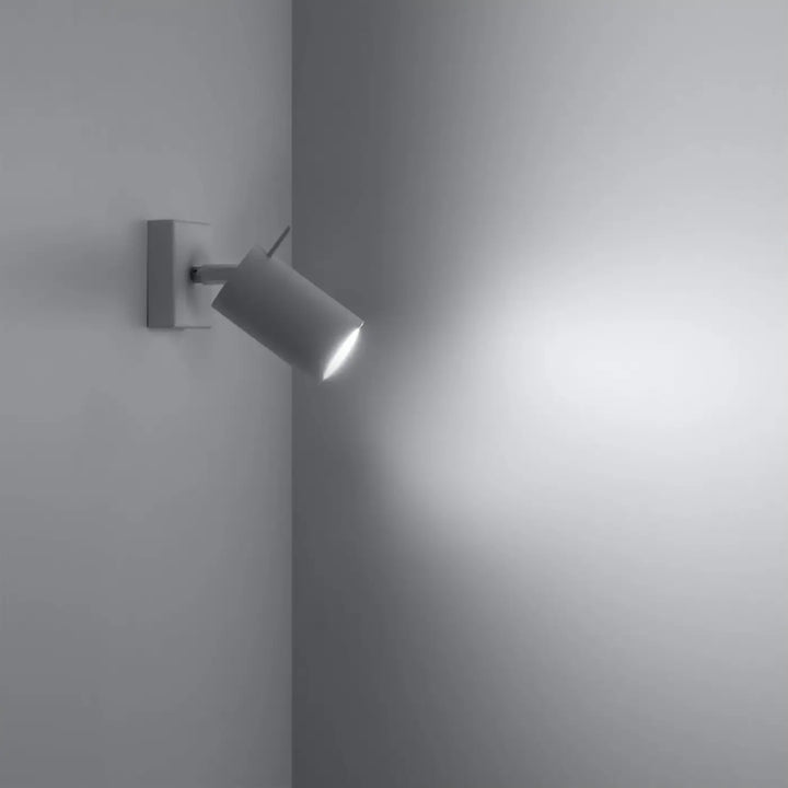 Applique murale ring blanche avec bras mobile et tête cylindrique offrant une totale liberté daménagement