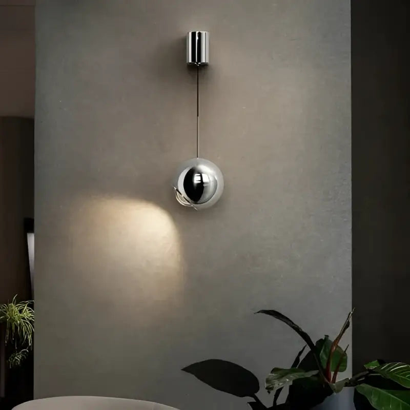 Applique murale boule métal noir orientable style moderne