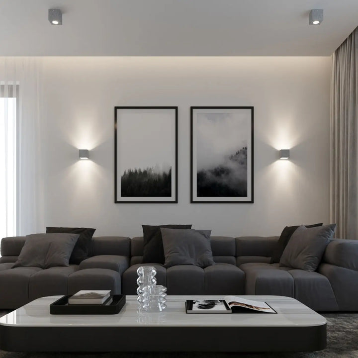 Modern gray sectional sofa with tufted cushions presented alongside applique murale quad beton for magnifique décoration