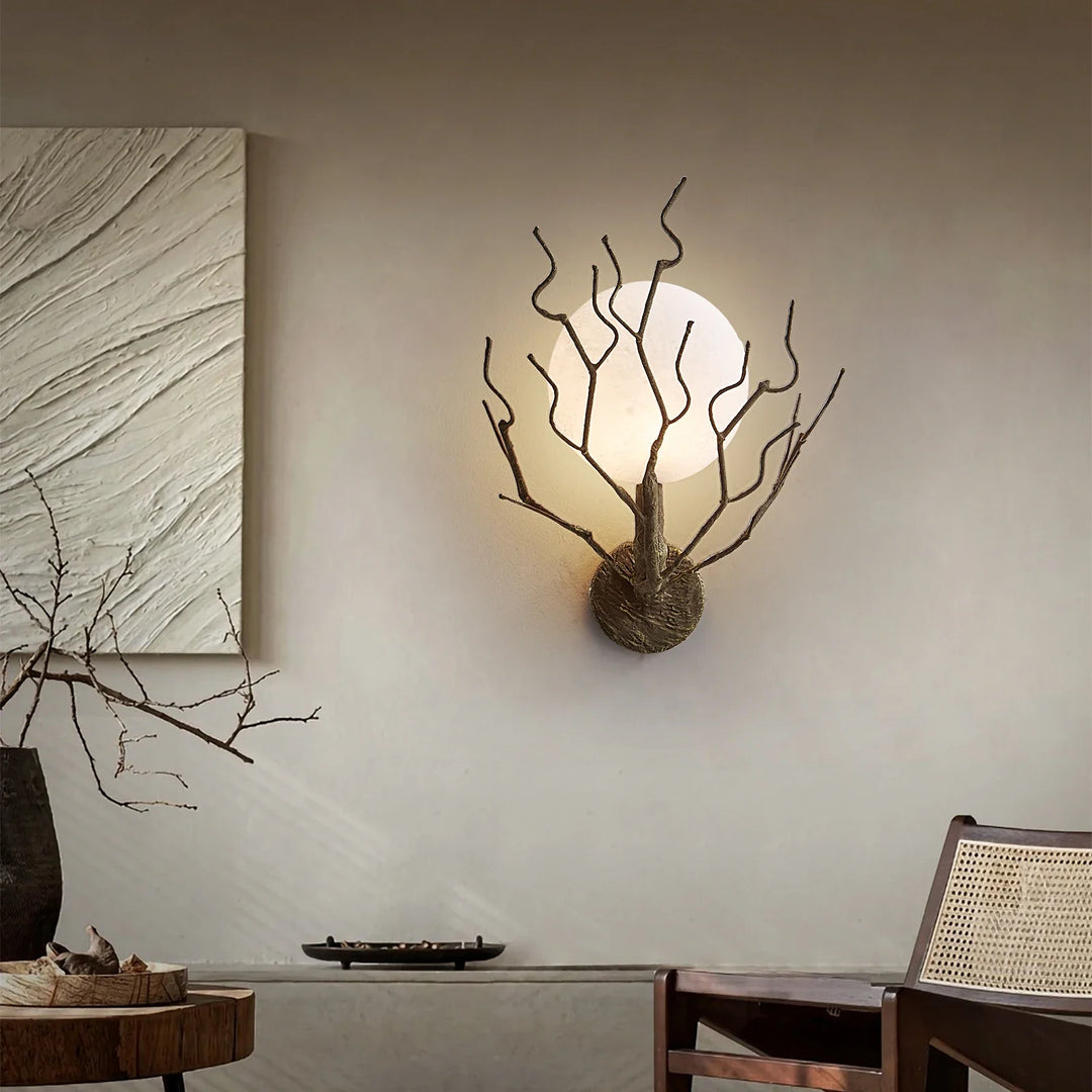Applique murale design branches en métal et globe lumineux chic