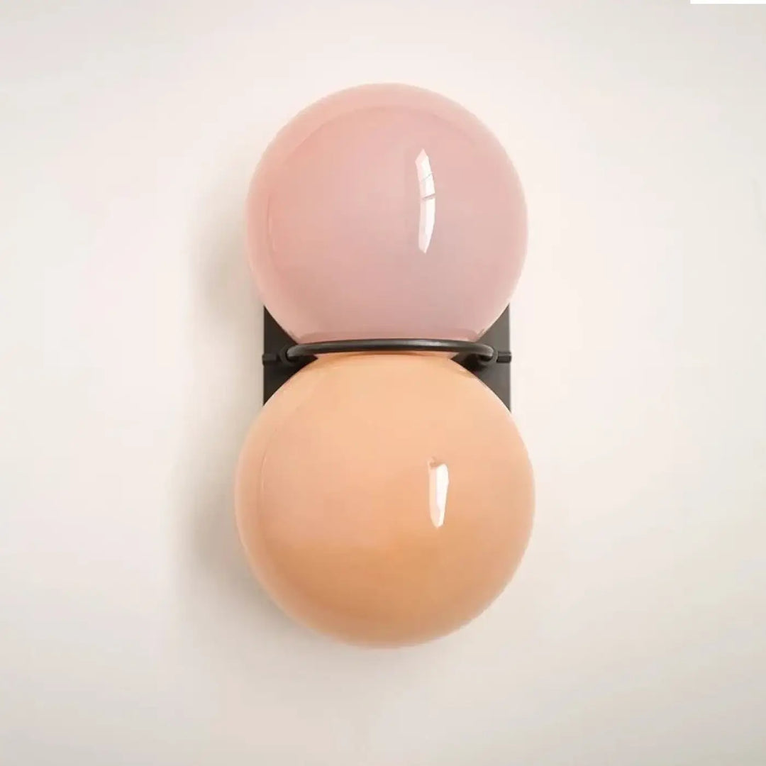 Applique murale gemini double boule en verre sphérique pastel rose et pêche avec support métal noir pour décoration intérieure