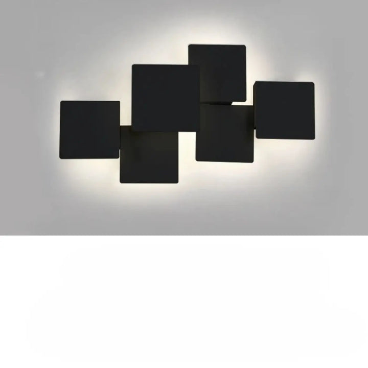 Applique murale kubora carrés flottants en noir avec un effet lumineux minimaliste et design contemporain