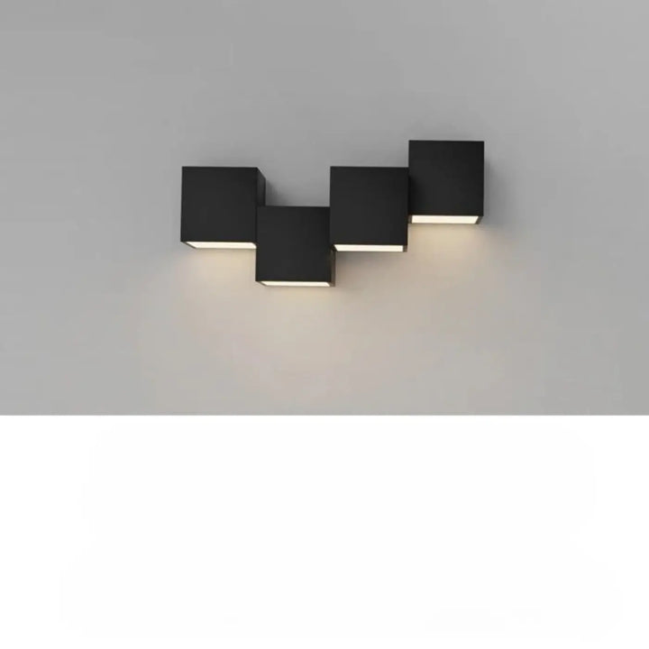 Applique murale kubora en cube noir moderne avec cornée minimaliste et effet lumineux chaleureux pour ambiance flottante
