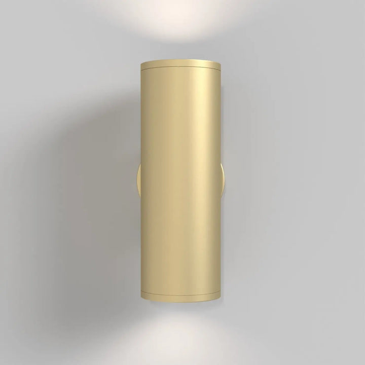 Applique murale focus s cylindre dorée avec design minimaliste et finition métallique pour éclairage intérieur moderne