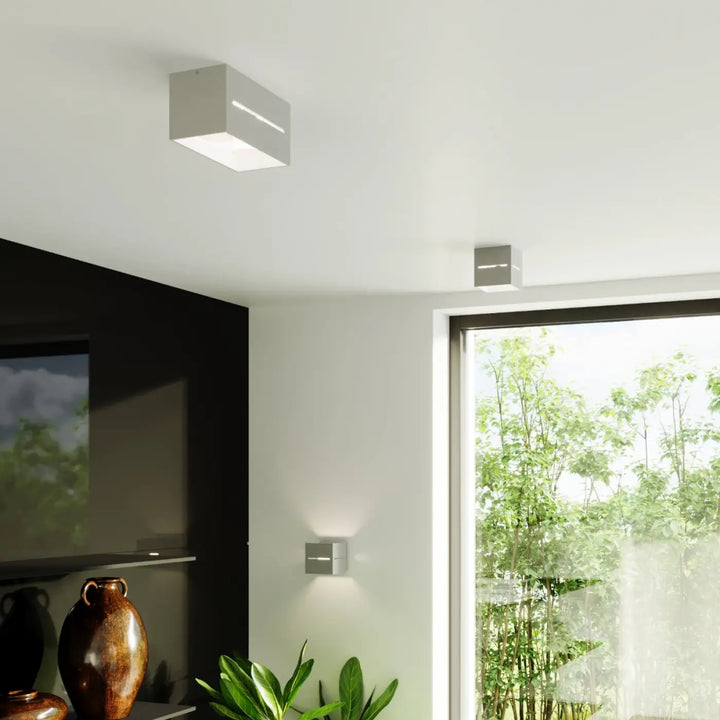 Applique murale moderne lobo maxi gris avec perforation lobo et éclairage led intégré minimaliste au plafond
