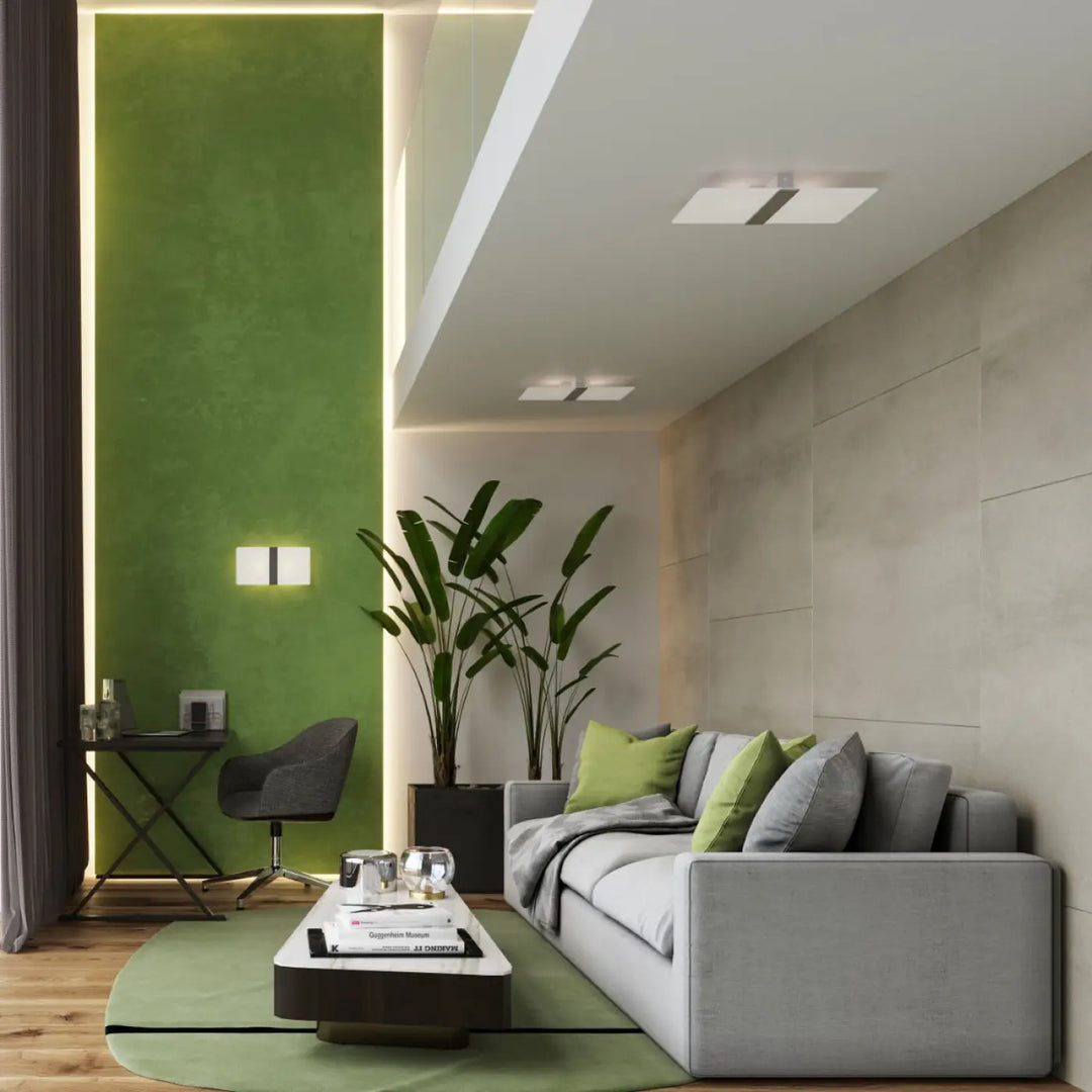 Applique murale azalia avec canapé gris en tissu et coussins verts et gris blanc met magnifiquement design intemporel