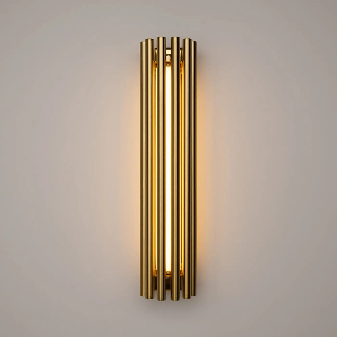 Applique murale sonata cylindre en tons dorés avec tubes cylindriques verticaux et lumière murale led chaleureuse