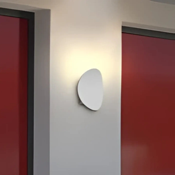 Applique murale aurelia minimaliste blanche design ovale lisse pour éclairage intérieur élégant et contemporain