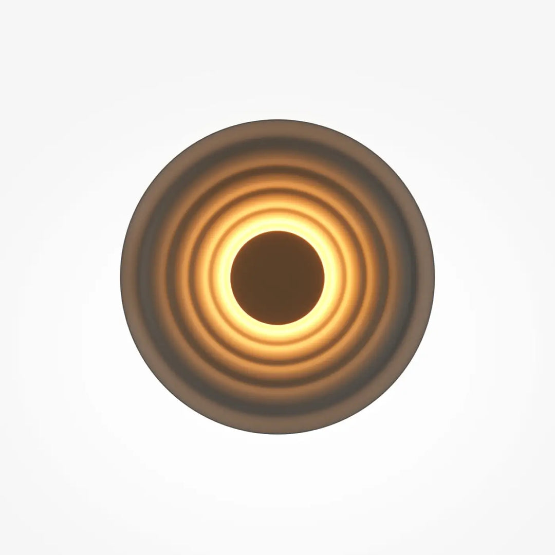 Applique murale nami disque ondulé avec un anneau concentrique diffusant une lumière ambre chaude