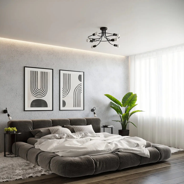 Gray tufted platform bed with white bedding showcasing the incroyablement stylées collection levar noir applique murale