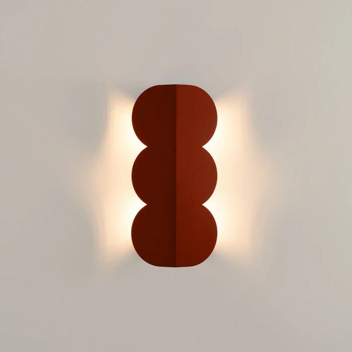 Applique murale BISCUIT ocre rouge allumée, vue de face