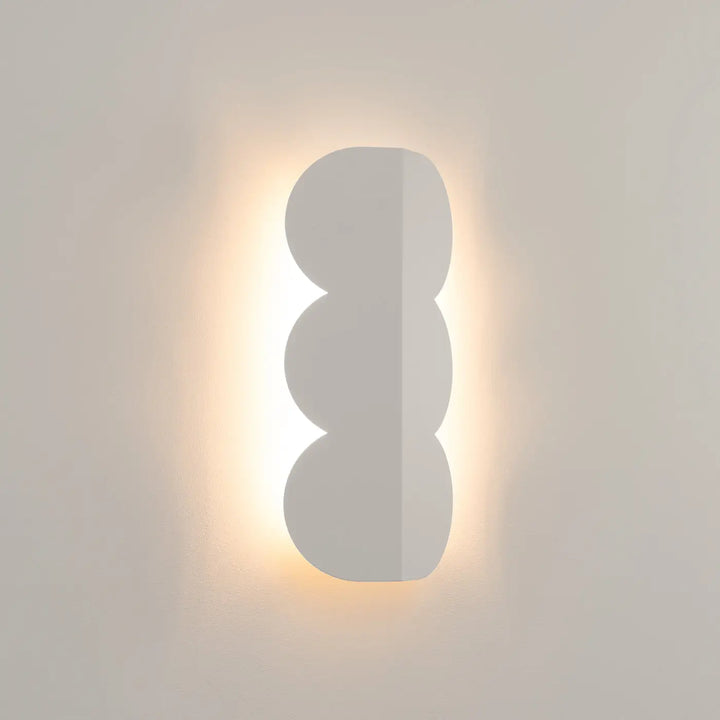 Applique murale BISCUIT beige allumée, halo sur le mur