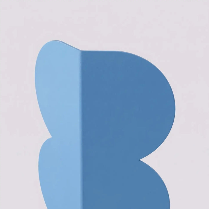 Applique murale BISCUIT bleu clair détail de la forme ondulée