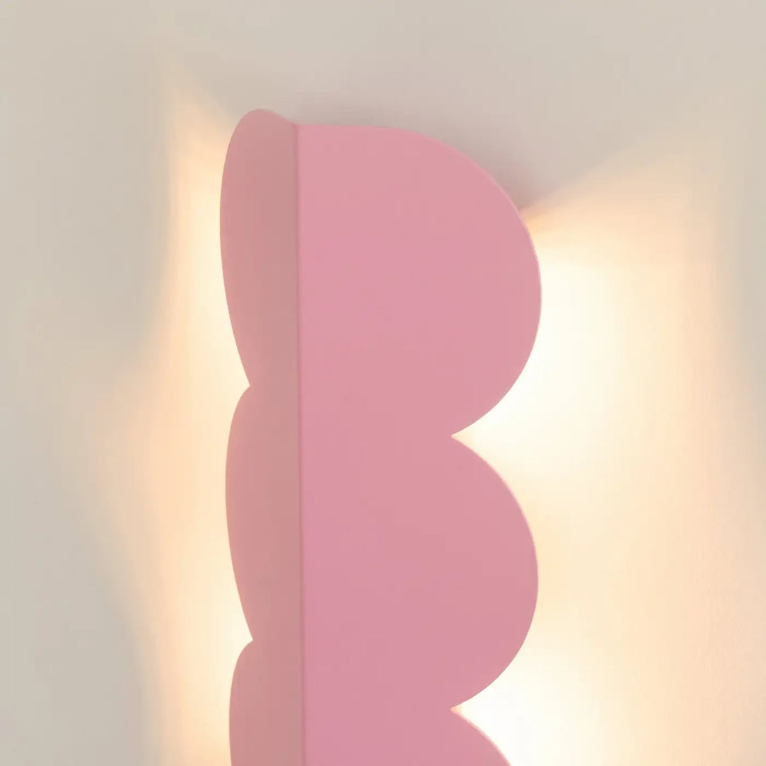 Applique murale BISCUIT rose allumée, vue de profil