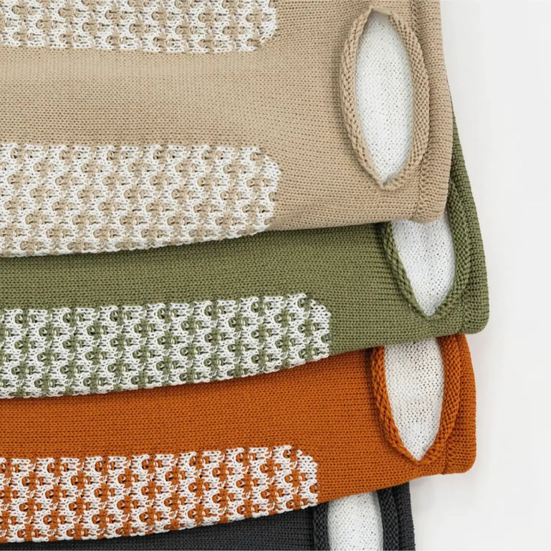 Stacked applique murale pantaya knit vests by patricia urquiola in beige olive green and orange with white tricot tendu panels