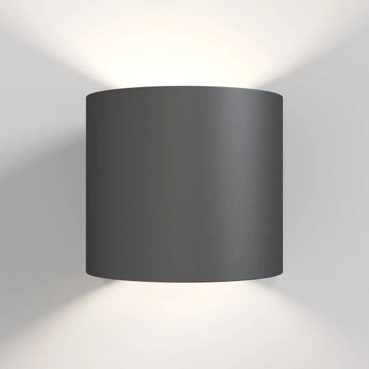 Applique murale rond cylindrique en verre noir mat avec lumière douce et design minimaliste moderne