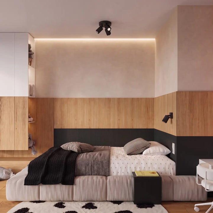 Applique murale Rayo en aluminium noir à réflecteur rainuré dans une chambre