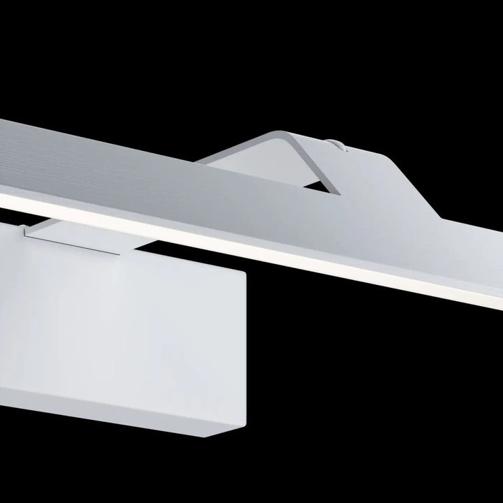 Applique murale decart avec lumière neutre led en métal noir au-dessus d’un tableau au design moderne blanc mat