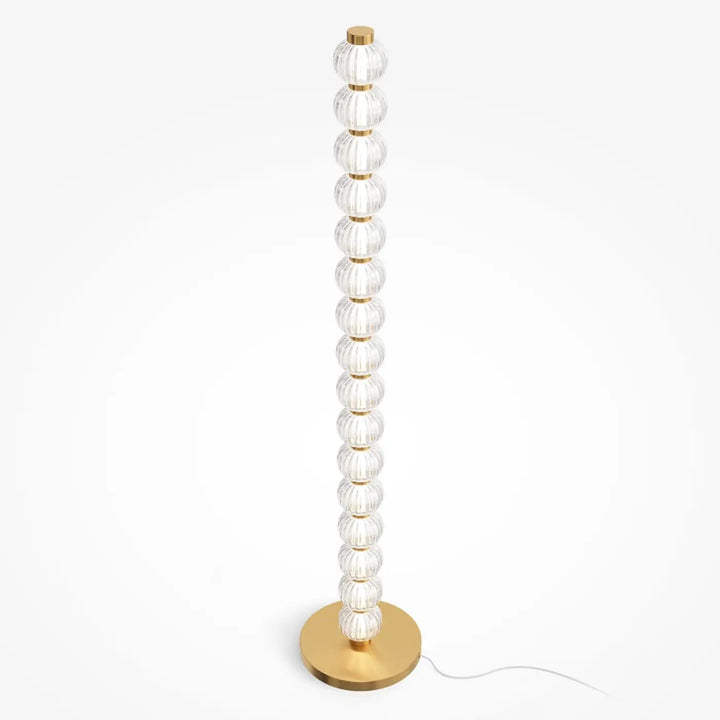 Lampadaire amulet en métal doré avec des orbes en verre strié empilées verticalement sur base élégante