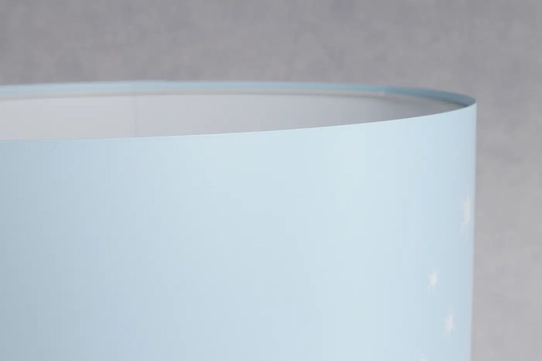 Lampadaire enfant with a smooth light blue cylindrical lampshade offering plus qu’un simple lighting solution