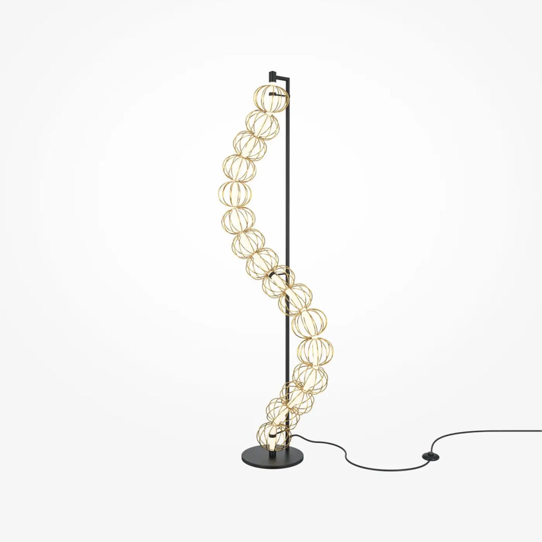 Lampadaire golden cage moderne avec pied noir et cages sphériques dorées en fil métallique élégamment courbées