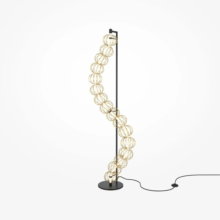 Lampadaire golden cage moderne avec pied noir et cages sphériques dorées en fil métallique élégamment courbées