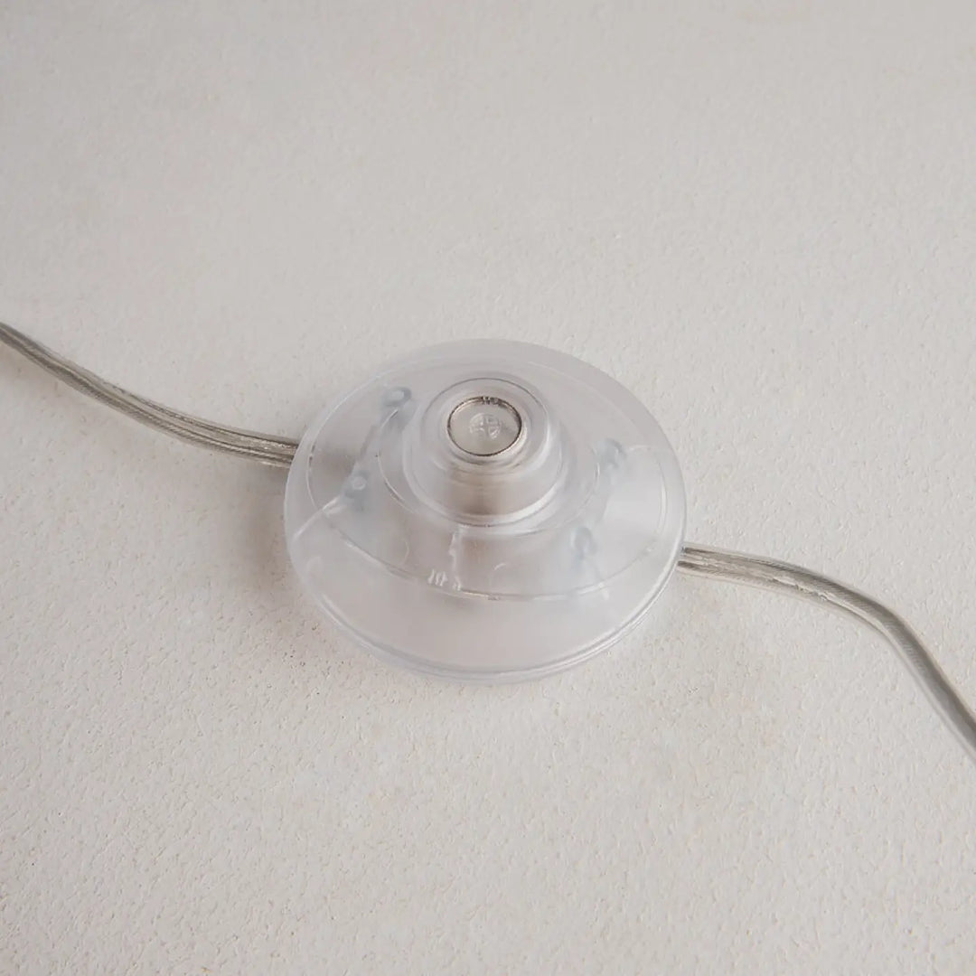 Interrupteur en plastique transparent avec centre métallique et fils argentés pour lampadaire kyoto base effet marbre