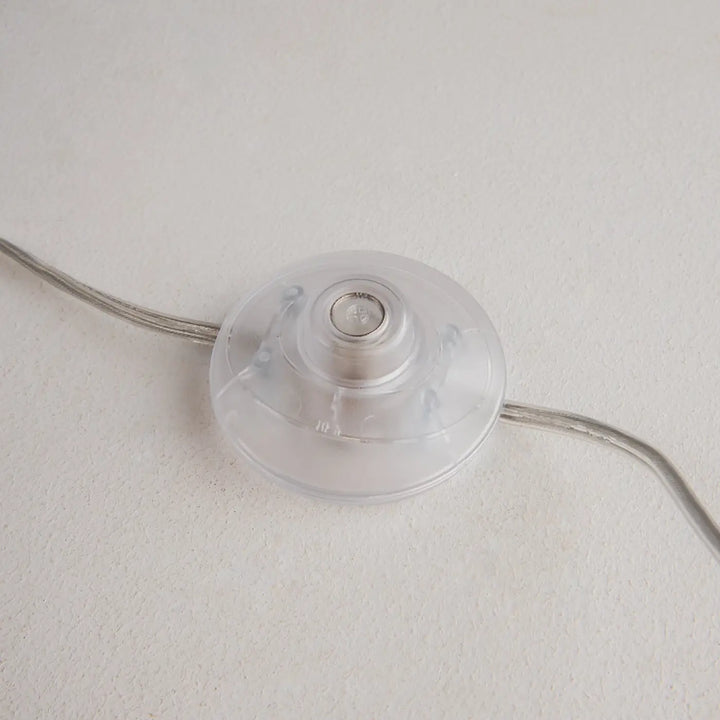 Interrupteur en plastique transparent avec centre métallique et fils argentés pour lampadaire kyoto base effet marbre