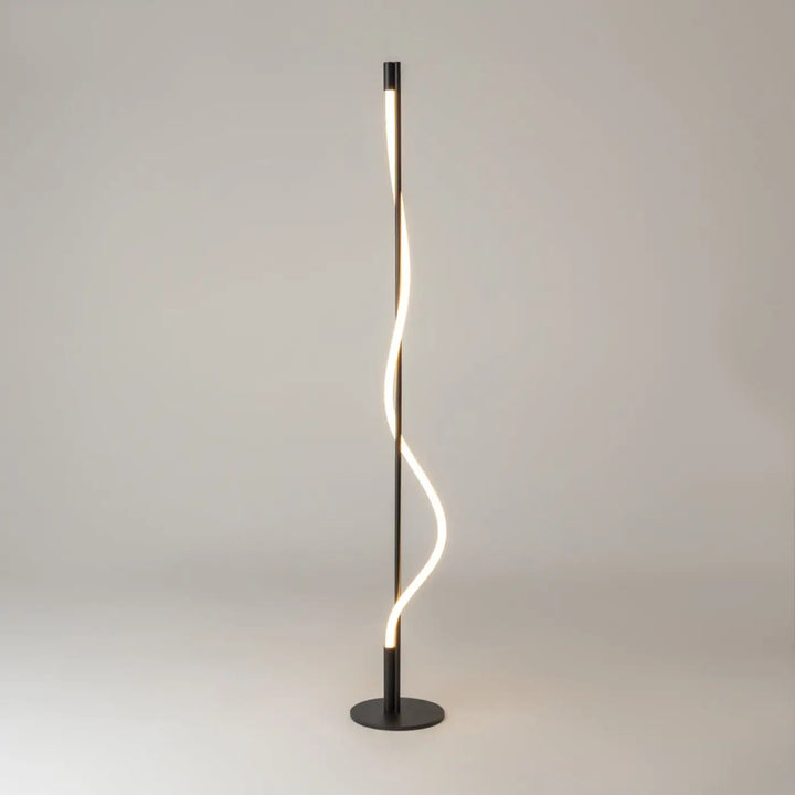 Lampadaire tau noir moderne avec ruban lumineux led torsadé et cadre mince diffusant une lumière chaude