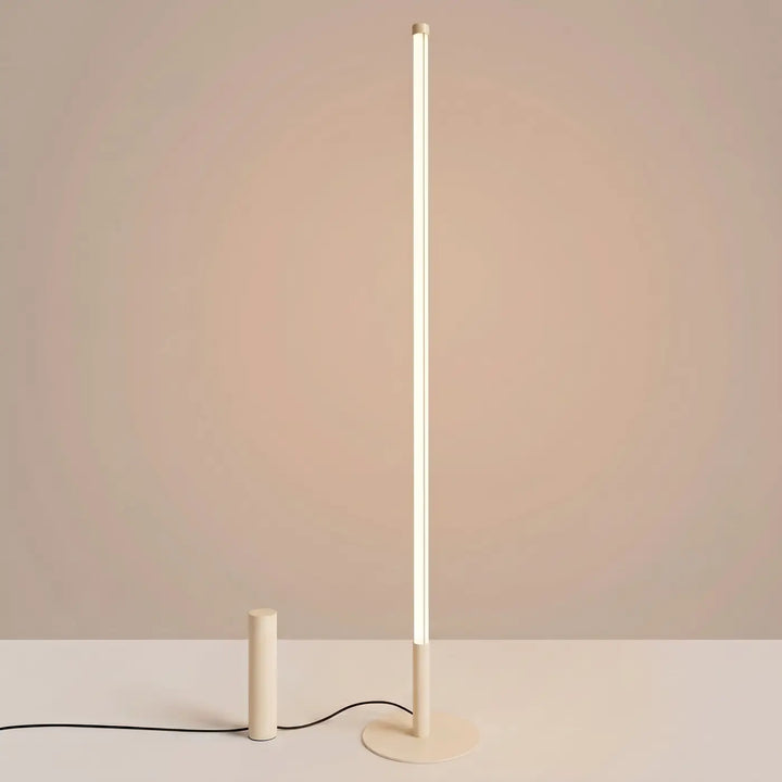 Lampadaire TRANG beige allumée, tube lumineux