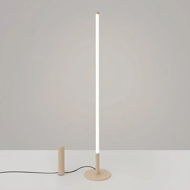 Lampadaire TRANG beige allumée, tube lumineux