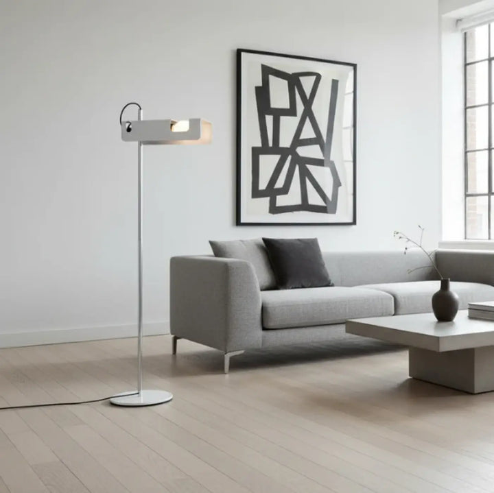 Lampadaire moderne orix avec finition métallique argentée et tête rectangulaire pour éclairage directionnel structure fine