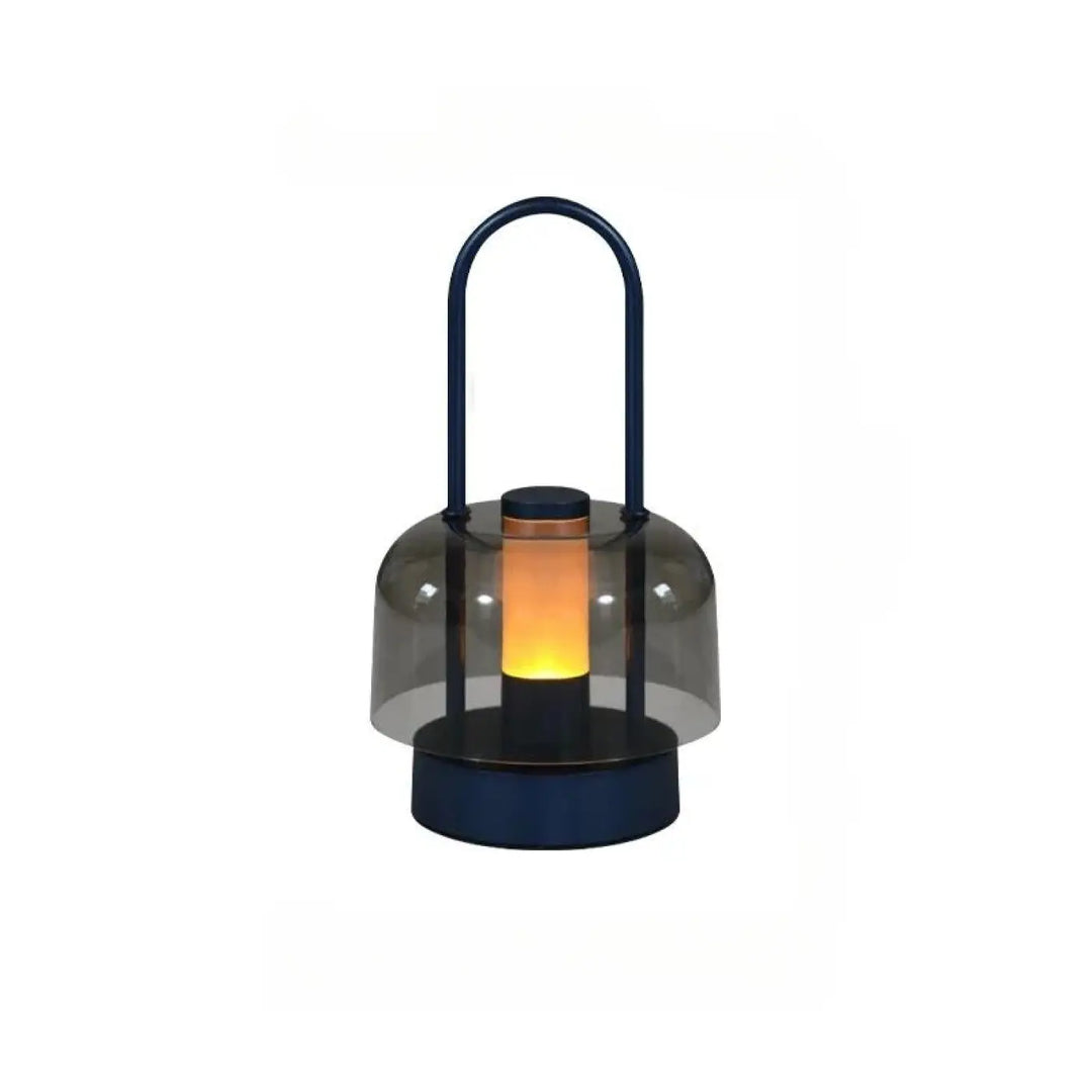 Lampe de table Cristo en bleu marine avec verre fumé et poignée arche diffusant une lumière chaude pour night light