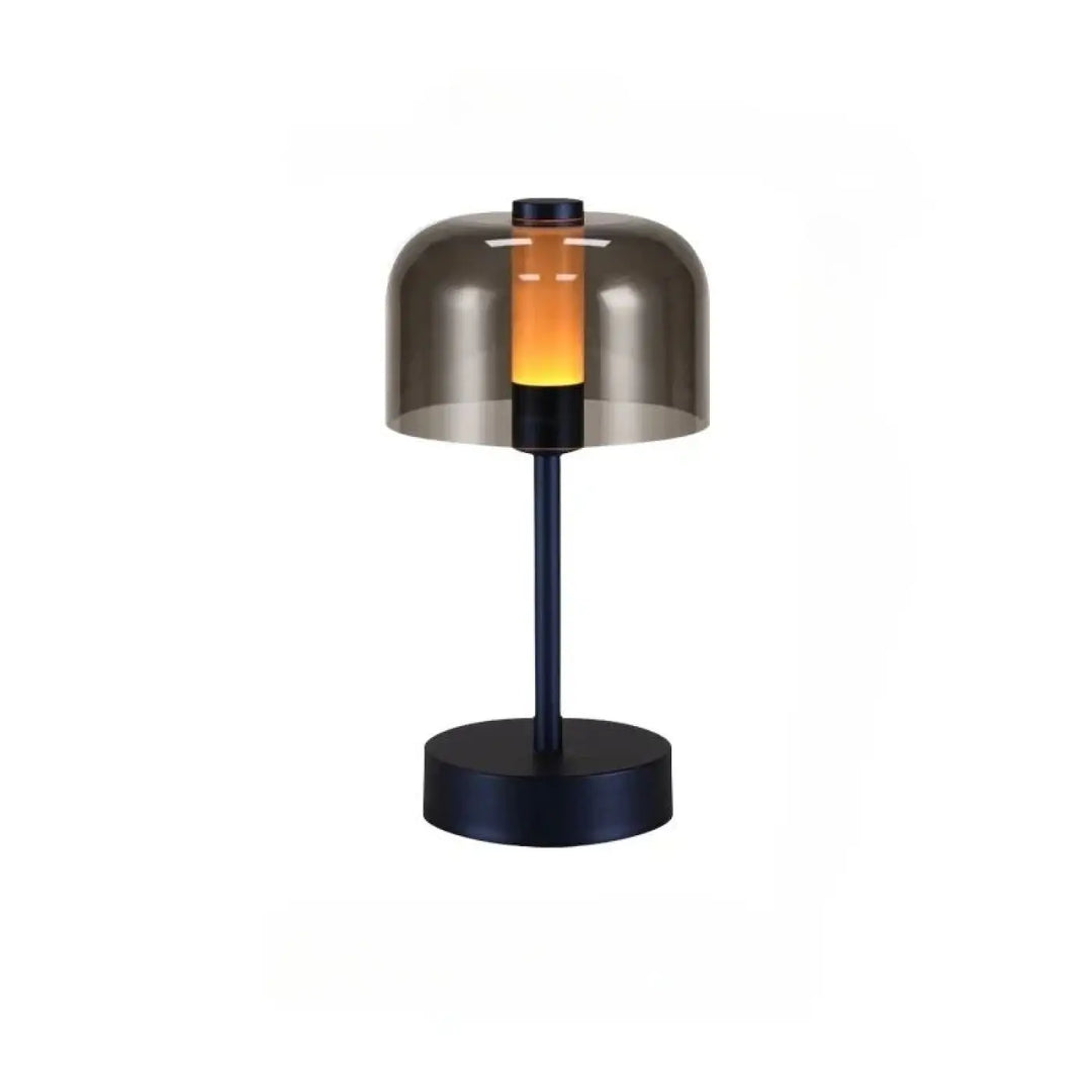 Lampe de table cristo avec base et tige en métal noir et dôme en verre fumé diffusant une lumière ambre chaude pour veilleuse