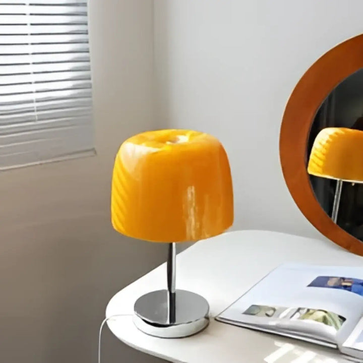 Lampe de chevet noria en verre translucide orange avec base chrome pour décoration intérieure et chevet design
