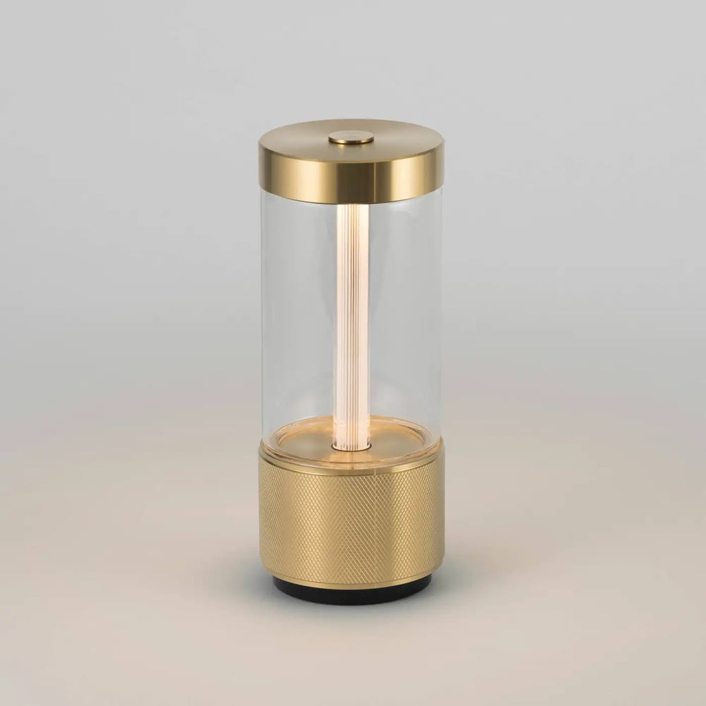 Lampe de chevet Takeout finition laiton, allumée #couleur_dor