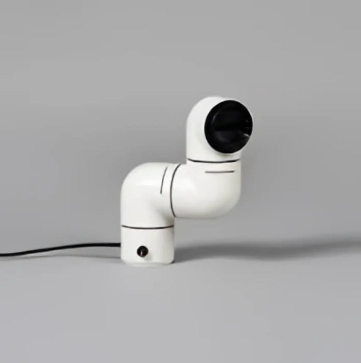 Lampe de chevet alana avec bras robotique blanc et articulation sphérique noire au design chevet rétro futuriste