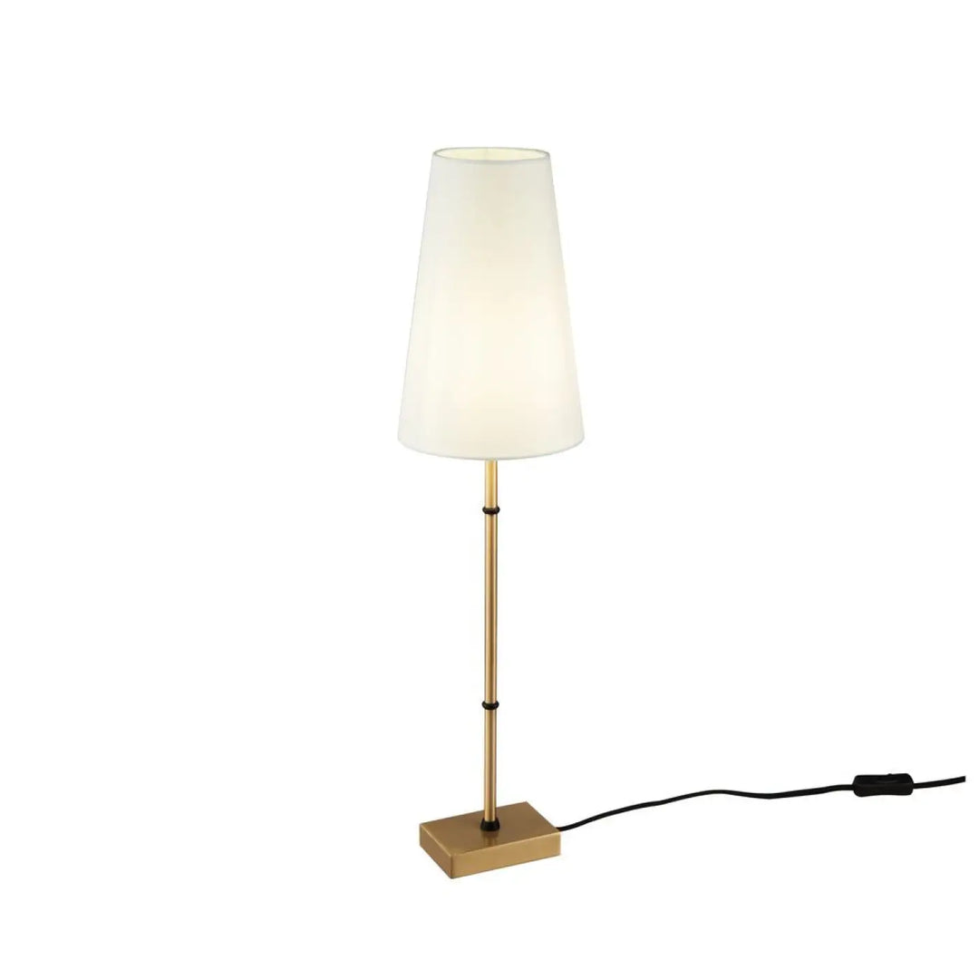 Lampe de chevet zaragoza avec pied doré en laiton et abat-jour clair en tissu pour une lumière douce et élégante